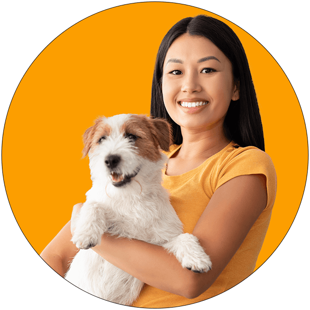 Girl hold the dog with orange background